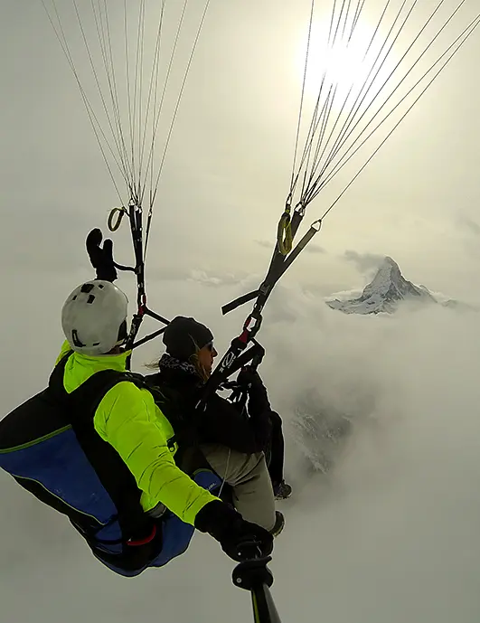 Amazing flight through clouds in front of the Matterhorn