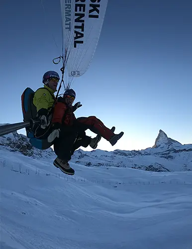 Winter Tandem Paragliding Flight in front of the Mighty Matterhorn